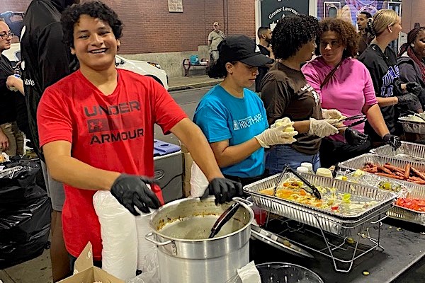 Matthew Vallejos serves food to people who face homelessness.