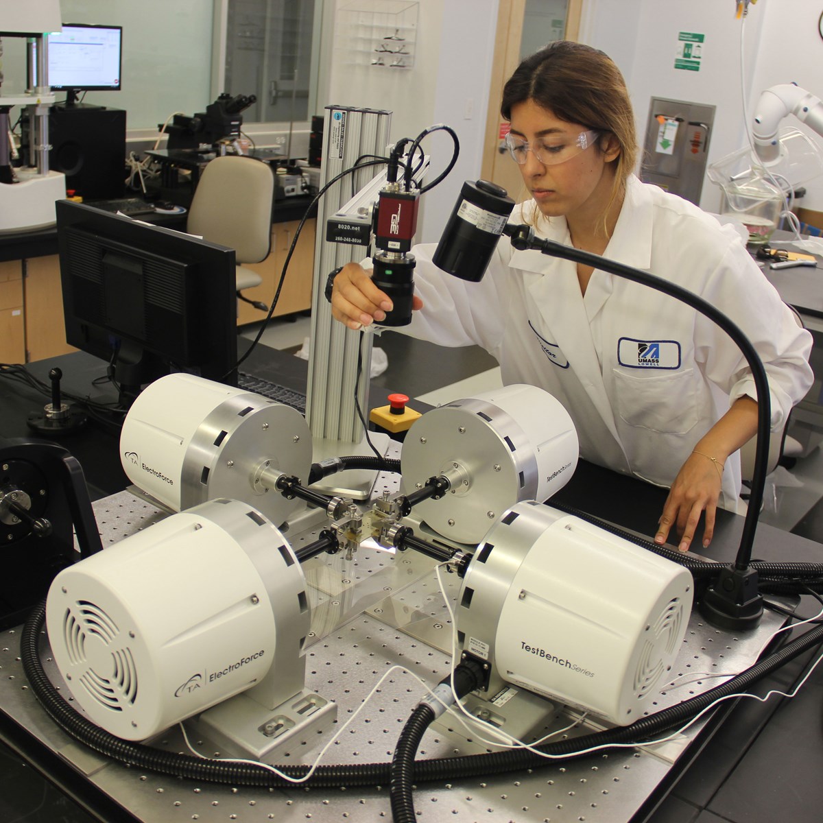 A female graduate student works on Mechanical Engineering equipment