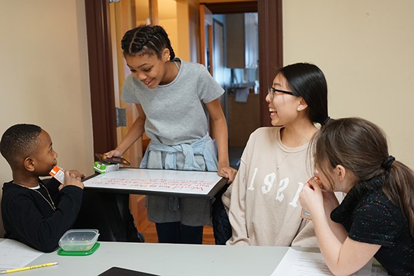 UML student Sofya Chow works with children at the CBA's after-school program
