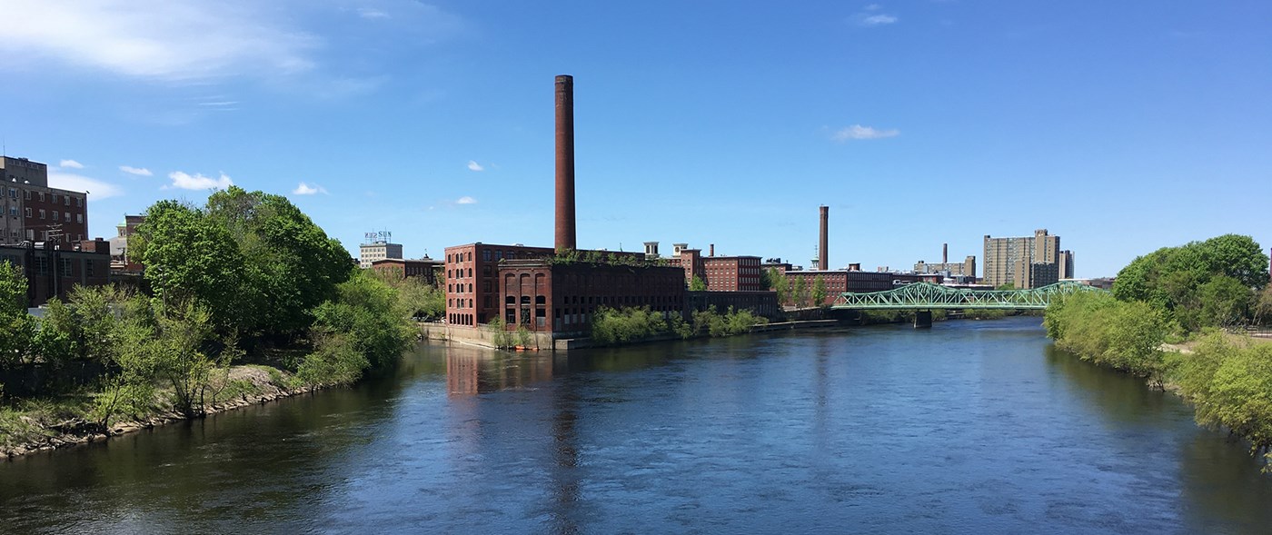 View of the Merrimack river with mill buildings in the background