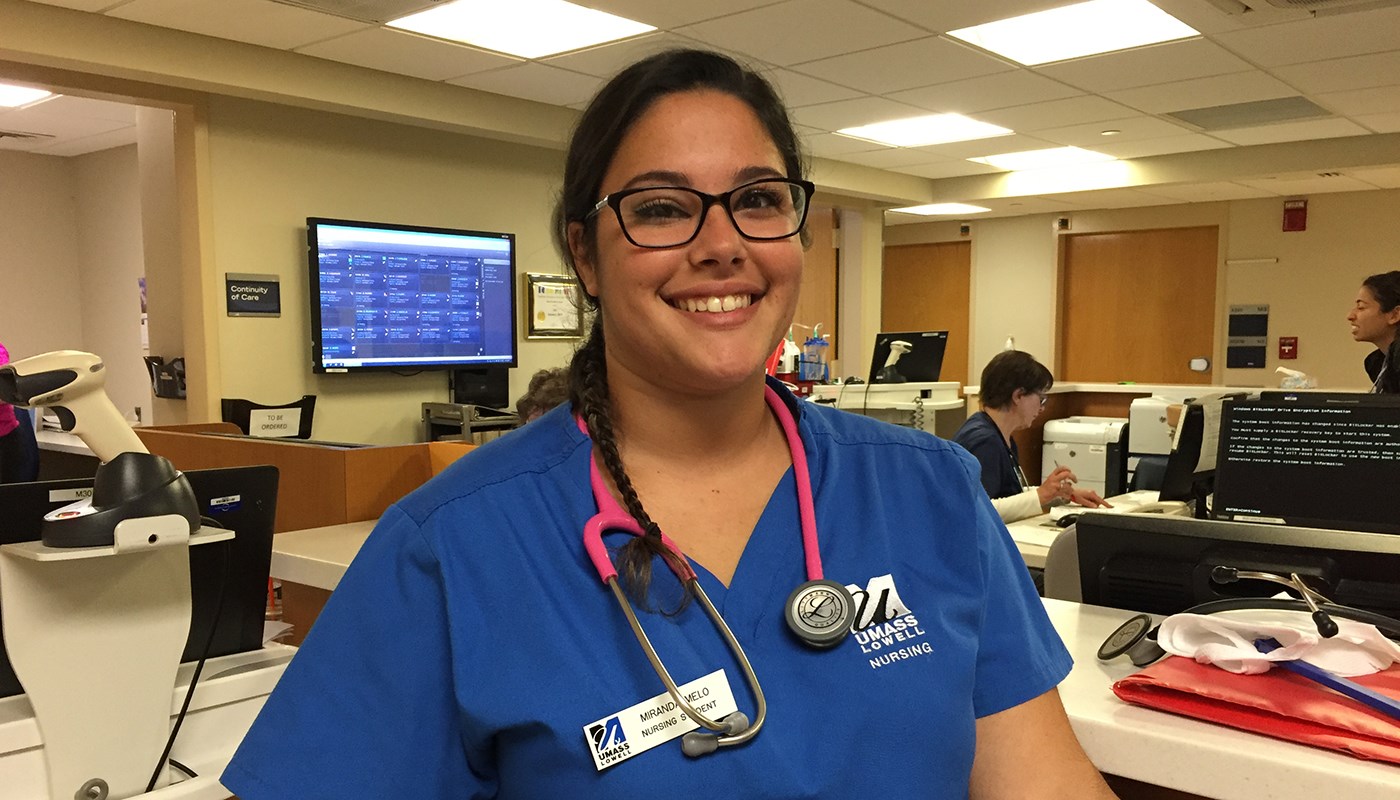 Nursing student Miranda Melo at her job a nurse's station in hospital