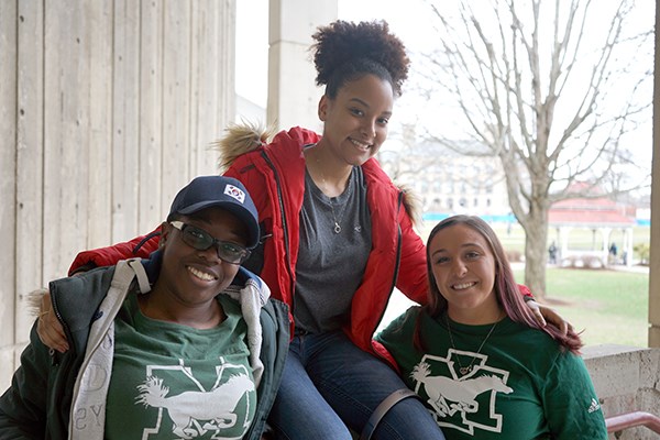 Transfer students Chantay Sewell-Jones, Nicole Morales-Taveras and Jessica D'Esposito outside O'Leary Library