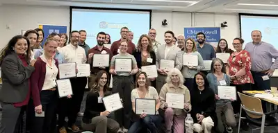 The first 24 participants in the Economic Development Academy pose with their certificates 