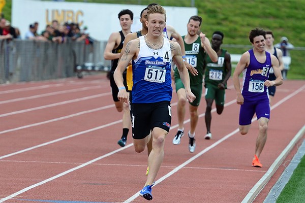 Junior Sean Munnelly sets record on track.