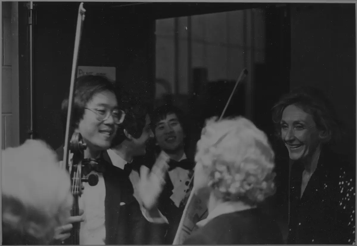 A black and white photo of Nancy Donahue with Yo-Yo Ma.