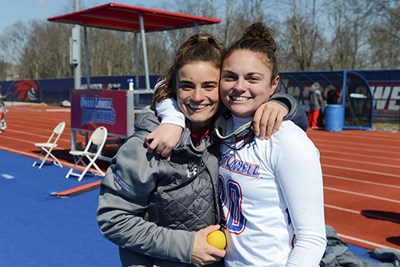 Noelle Lambert poses for a photo with assistant coach Carly O'Connell