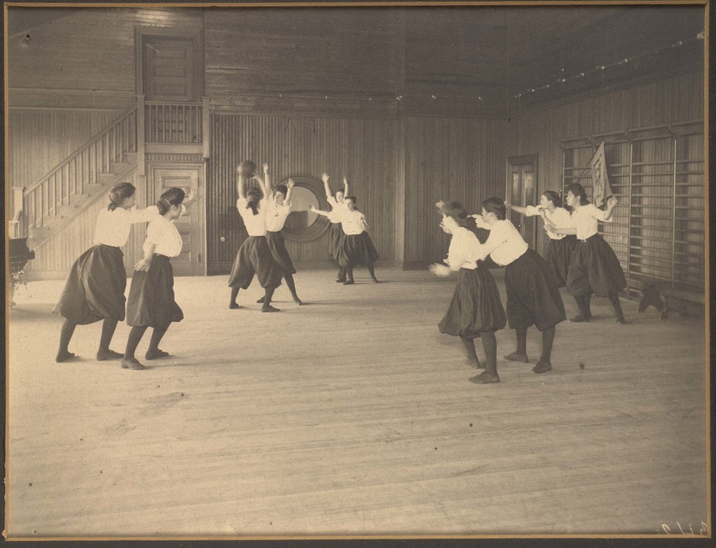 Around 1905, Lowell Normal School students wore bloomers and long-sleeved blouses to play basketball