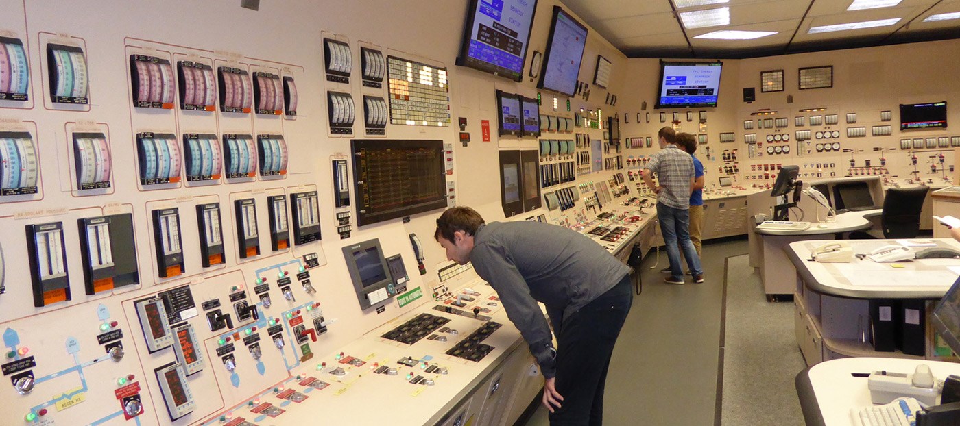 Chemical/Nuclear Engineering students working in the control room of the nuclear reactor.
