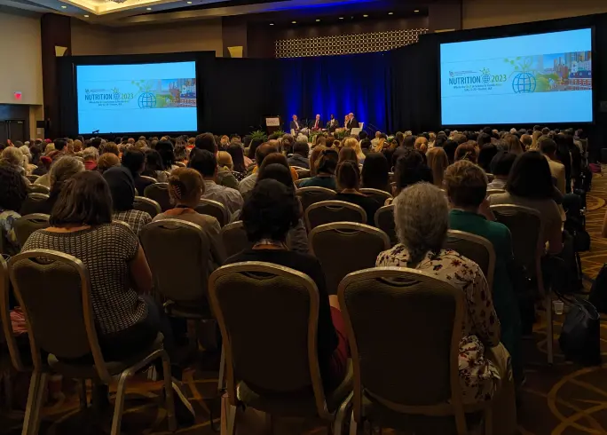 Members seated at a Nutrition-2023 conference
