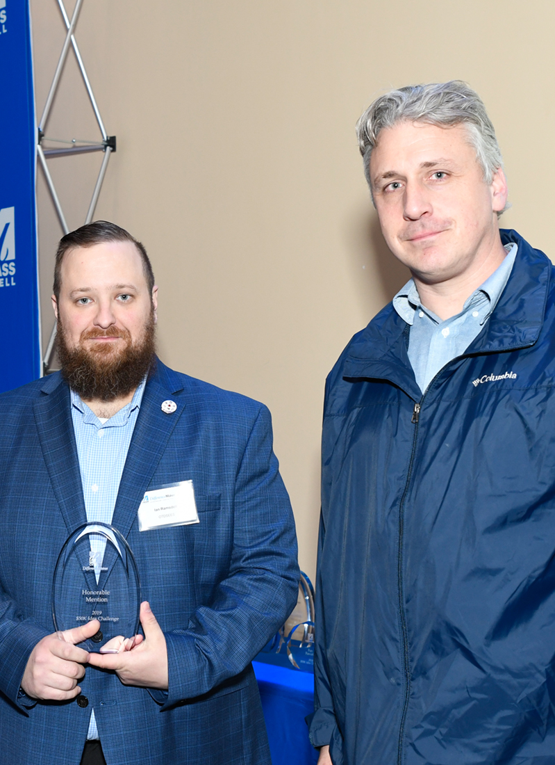 Ian Ramsdell and Dan Houlihan hold their Honorable Mention award for Over Terrain Tactical Scuba Personnel Delivery Service (OTDSEES) at DifferenceMaker