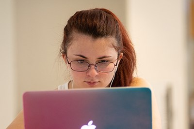 Student working at a laptop