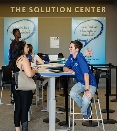 solution center student worker assisting students with quesitons