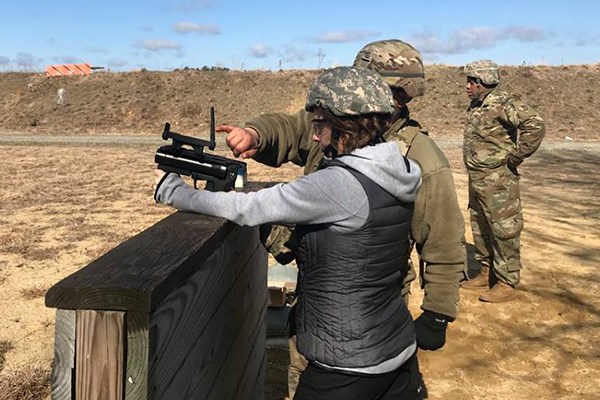 Kim Merriman learns how to fire a grenade launcher