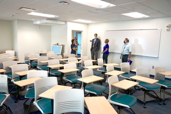 University administrators tour a new classroom