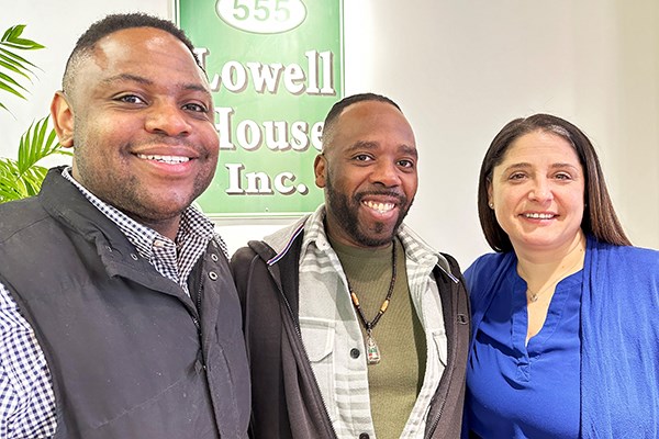 UML public health major Marcus Whitlow, center, with Shawn Bries and Gianna Sandelli '19, '22 at Lowell House Inc.