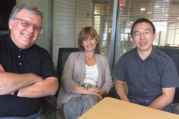 From left, UMass Lowell faculty members Ron Corbett, April Pattavina and Guanling Chen