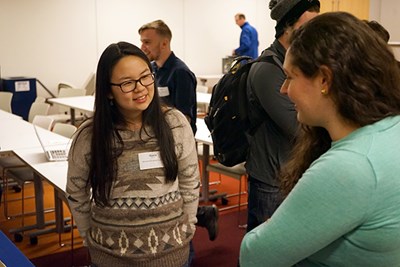 A student talks to an iRobot engineer after the event