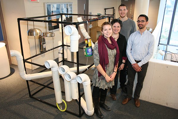 Students and faculty pose with an EcoSonic Playground prototype