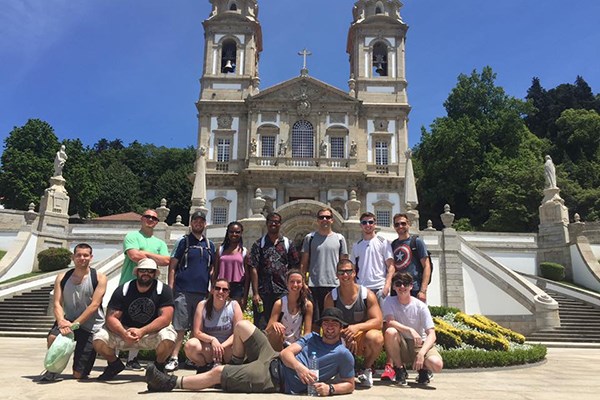 Students pose in front of Bom Jesus do Monte, a religious sanctuary overlooking Braga.