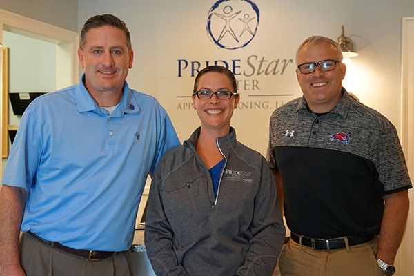 Frank McCabe, Alissa Rahilly '02, '12 and David Daly of PrideStar Center for Applied Learning