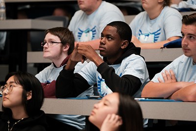 First-year, first-generation students at UML listen during induction day for the River Hawk Scholars Academy