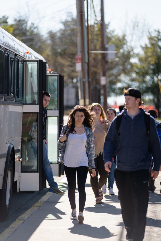 Students deboard the shuttle on South Campus