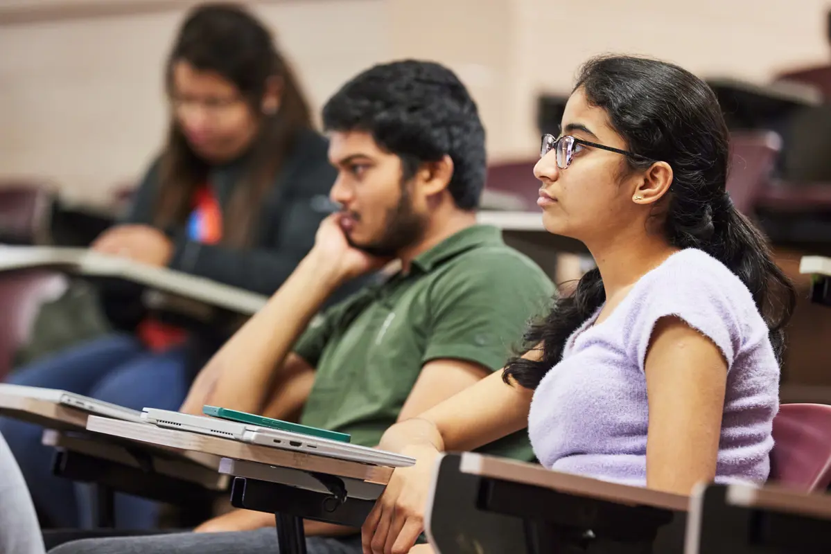 Students sitting in desks in classroom