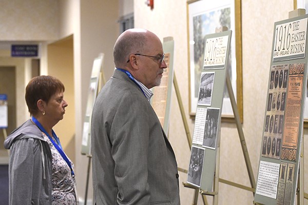 People look at posters at the "Remembering 1916" conference