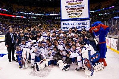 The men's ice hockey team celebrates its Hockey East title