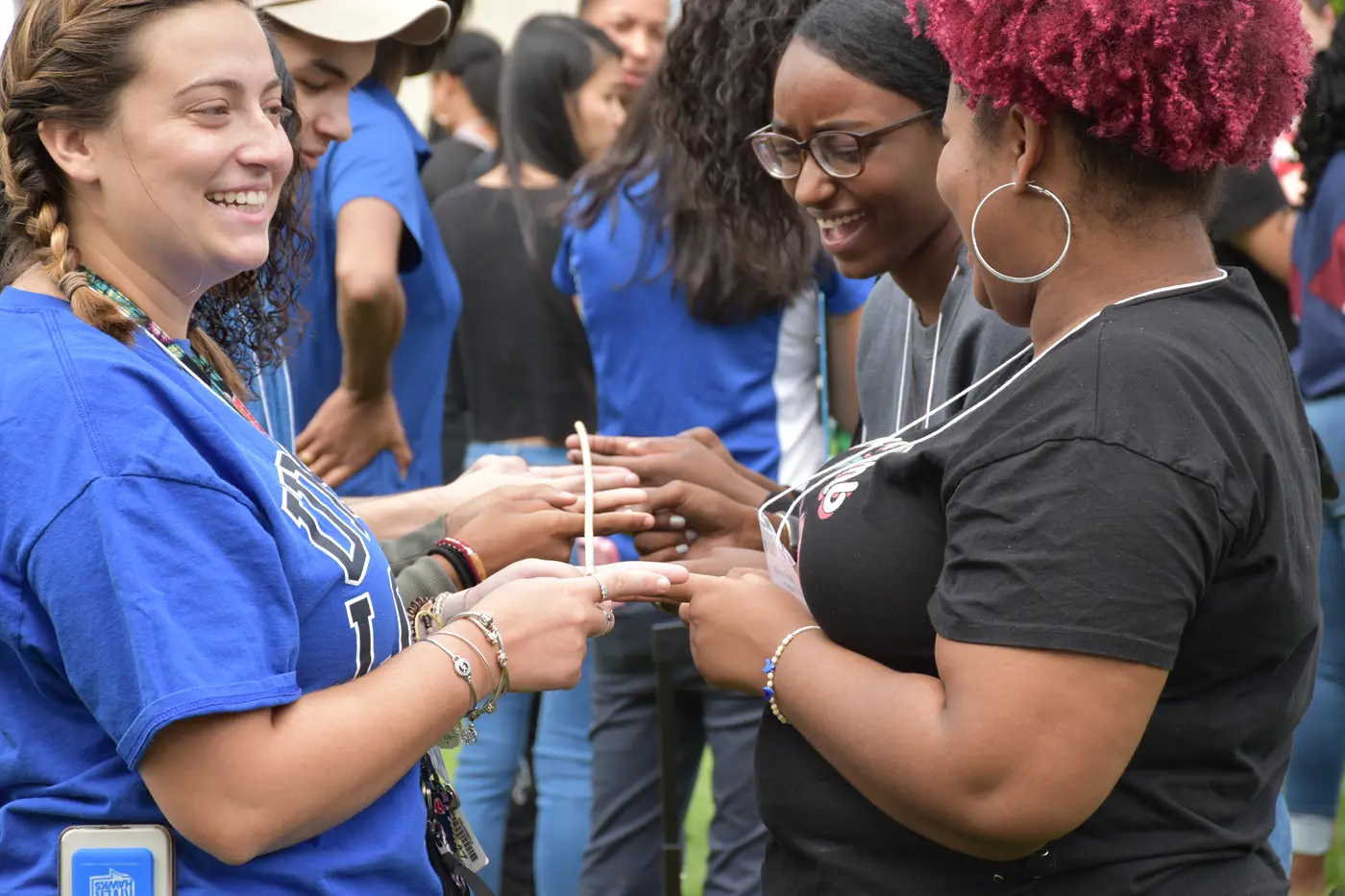Students talk with eachother during a River Hawk Rising experience