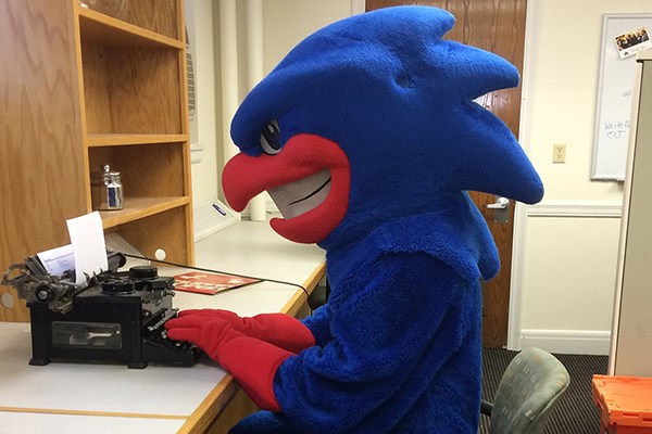 Rowdy the River Hawk gets help on his final paper at The Writing Center.