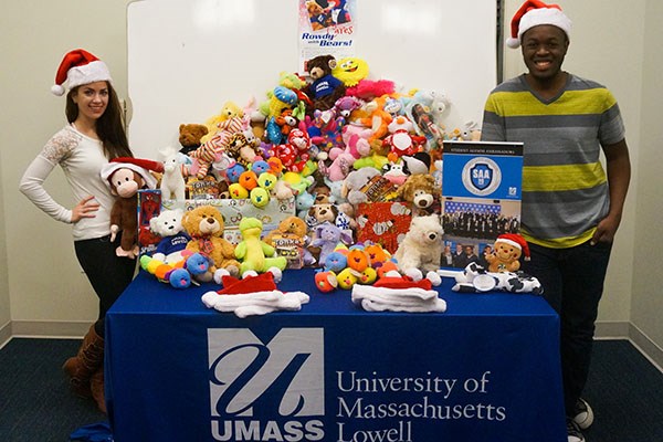 Student Alumni Ambassadors Catherine York and Ralph Saint Louis collect stuffed animals as part of the fourth annual Rowdy Cares with Bears drive.