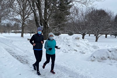 UMass Lowell Ph.D. students Pam Fallon and Sharifa Djurabaeva run at 6 a.m. with 261 Fearless