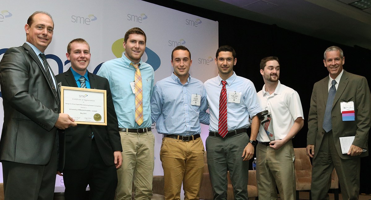 Second from left to right: mechanical engineering seniors Johnathan Lawson, Patrick Semeter, Taylor Breau, Anthony Ferrara and Jonathon Fournier receive their award from SME representatives Carl Dekker and Denis Cormier, far left and right, respectively. Photo courtesy SME.