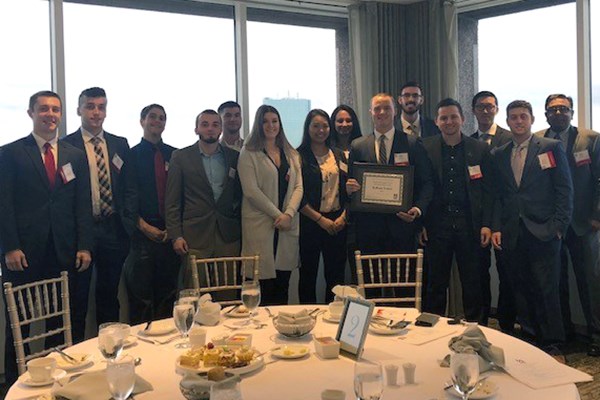 Student Managed Fund members pose at the UMass Club