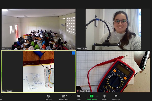 UML physics major Anne Souza teaches an online lab to science teachers in Haiti