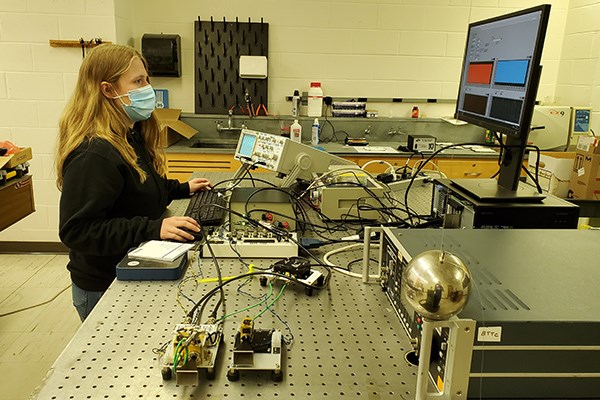 UML honors physics major Michele Woodland analyzes scanning radar signals in Prof. Robert Giles' lab