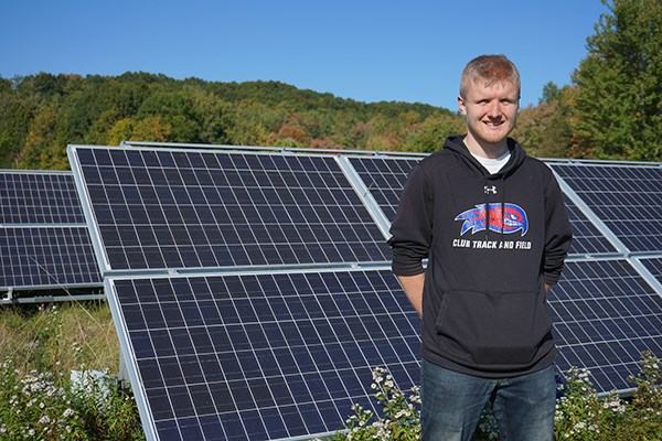 UML Honors environmental engineering major and energy engineering minor Joshua Walsh at a solar installation in Amesbury, Mass.