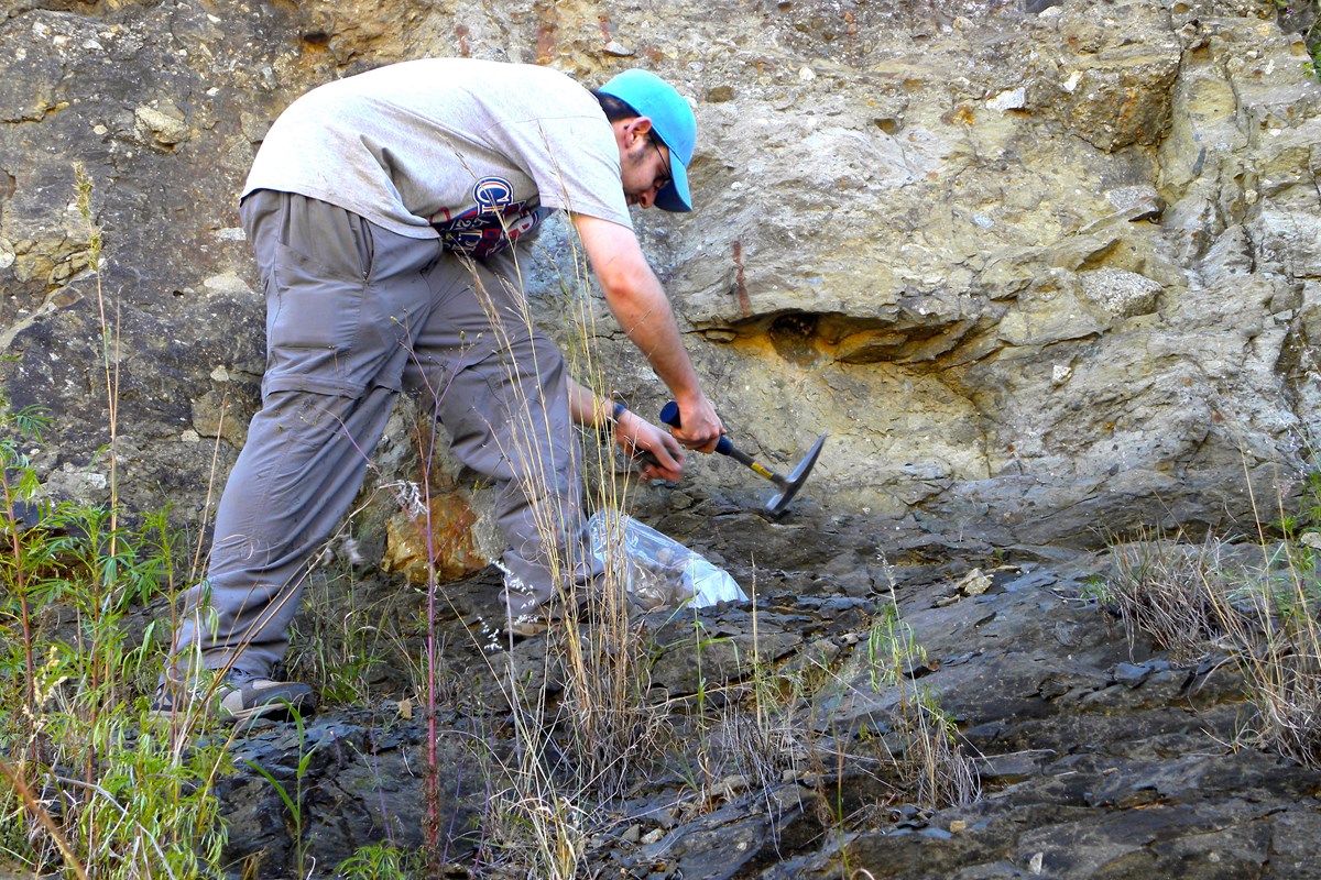 Assoc. Prof. Richard Gaschnig collecting samples of a glacial deposit.