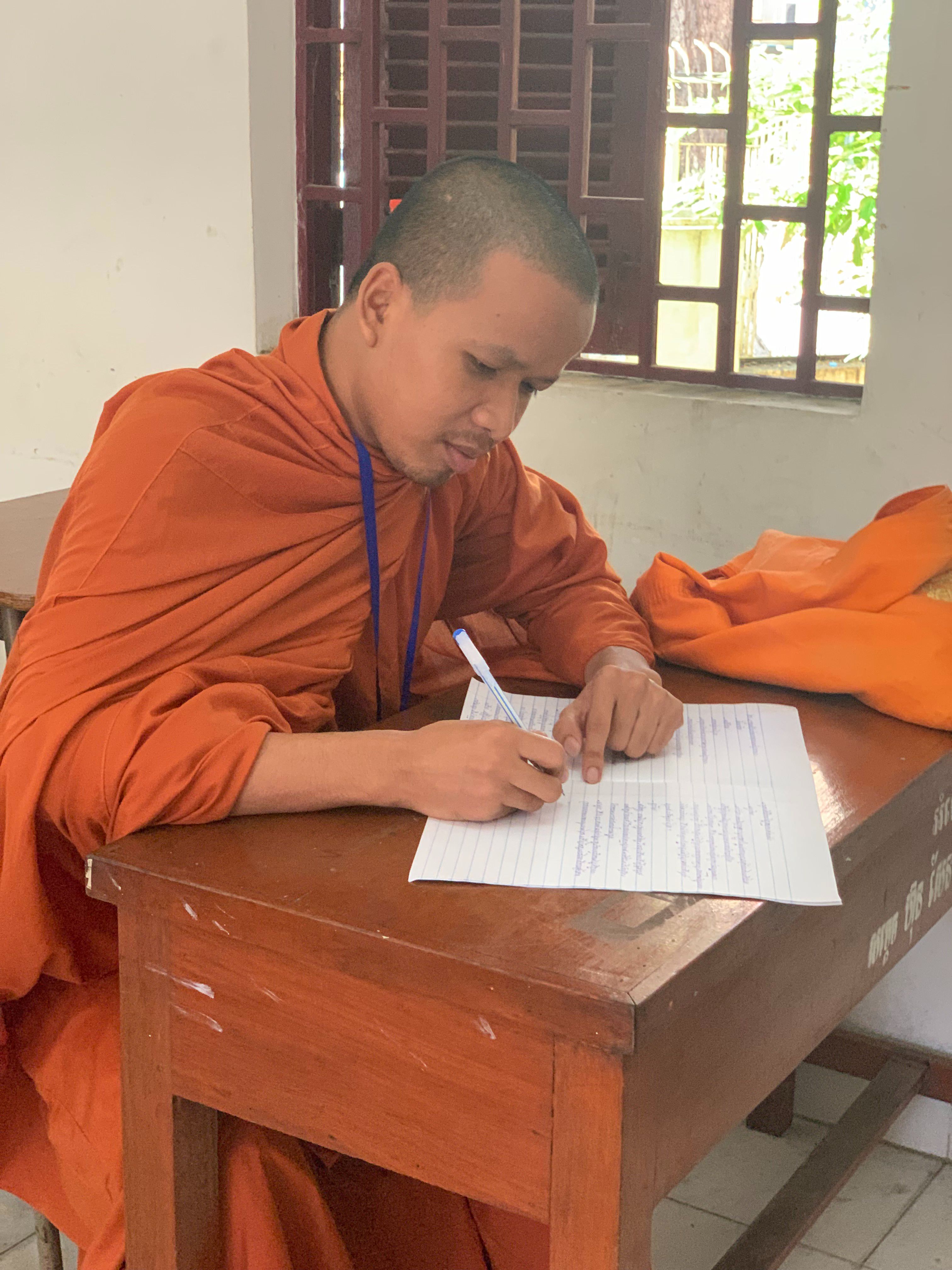 The photo taken in September 2019 shows Ven. Sarien Sib taking an exam at Preah Sihanouk Raja Buddhist University, Phnom Penh, Cambodia. Photo provided by Ven. Sarien Sib. 