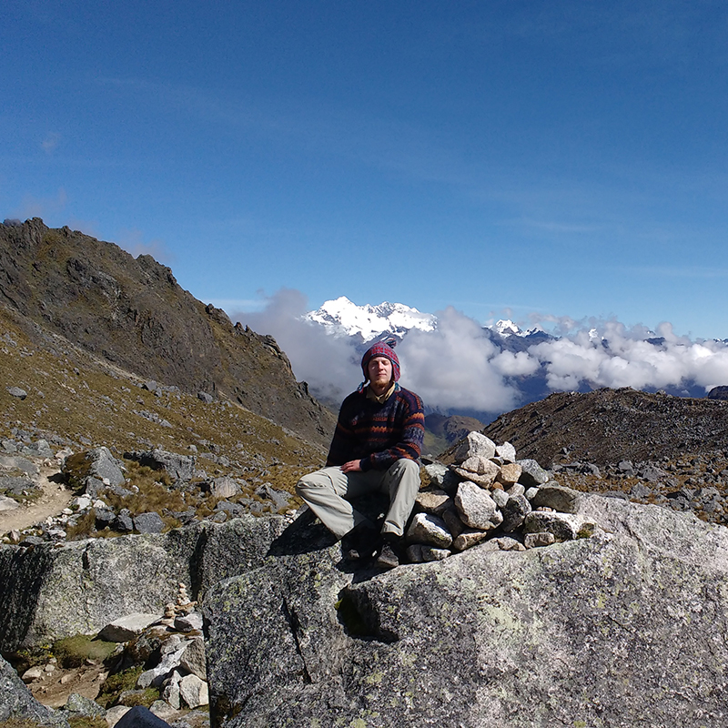 Biology major Sean Cloran poses in front of the Andes