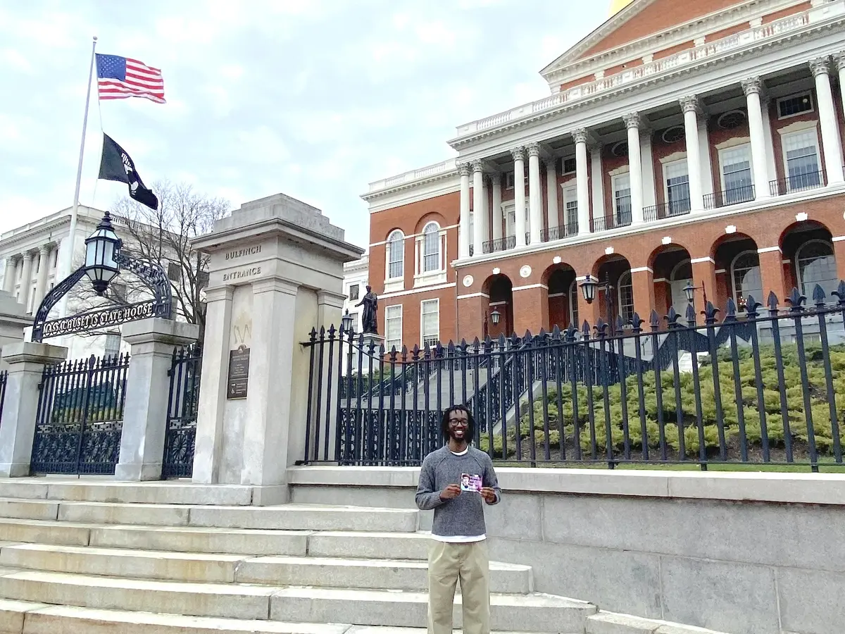 Shakeel Kawuba stands in front of state house