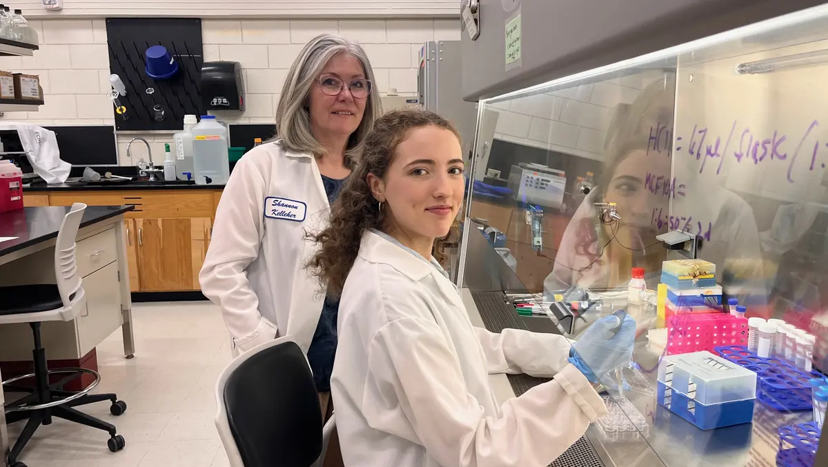 Shannon Kelleher with biology student in lab