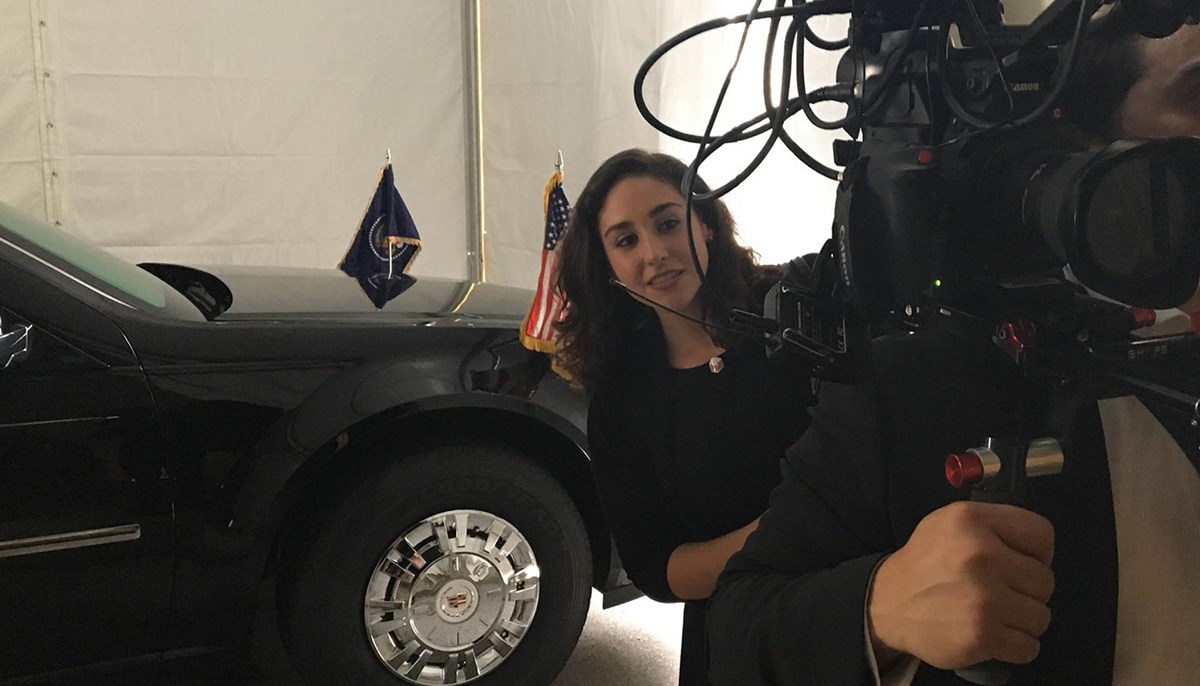 Political Science Alumna Sheila Angelo working behind camera