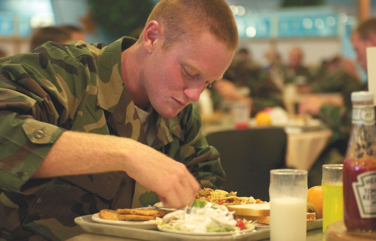 An image showing a soldier eating