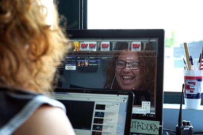 Denisse Torres enjoying a laugh while working