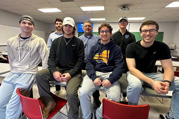 The first six UMass Lowell students to take Intro to Sports Engineering, with instructor Patrick Drane '00, '03, assistant director of the UML Baseball Research Center
