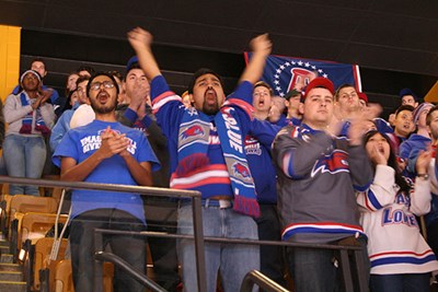 Fans cheer on the hockey team at TD Garden