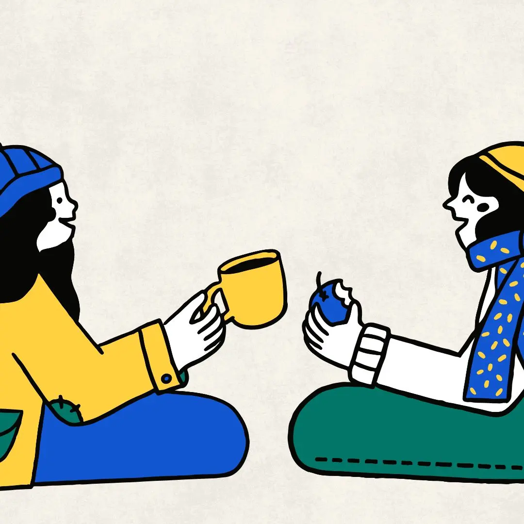 Two people talking with snacks