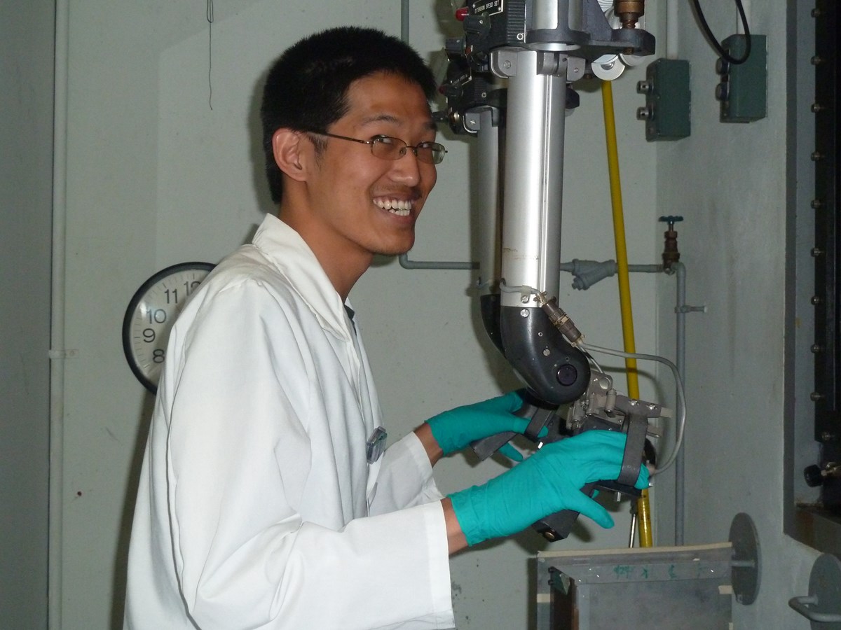 Student using remote manipulators in the reactor hot cell